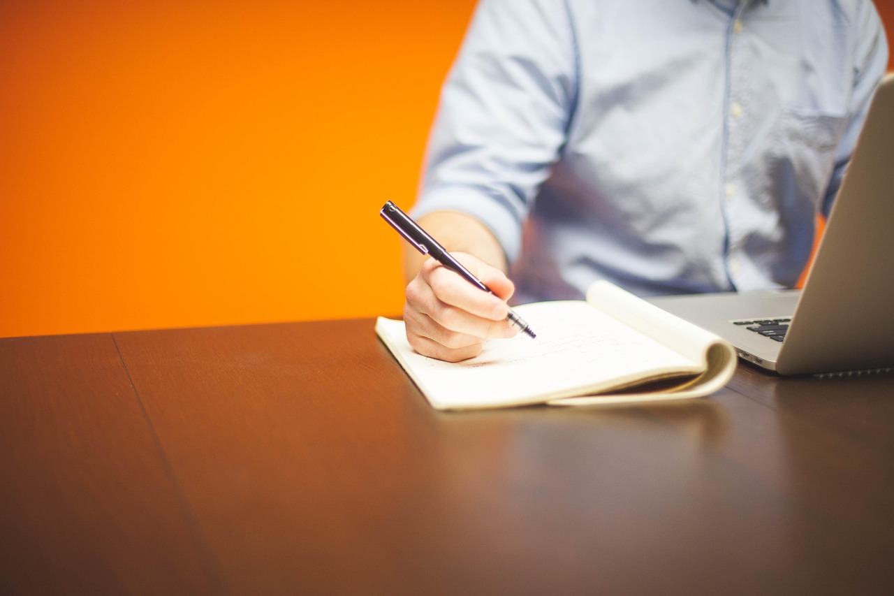 Notebook and pen on an adviser's desk