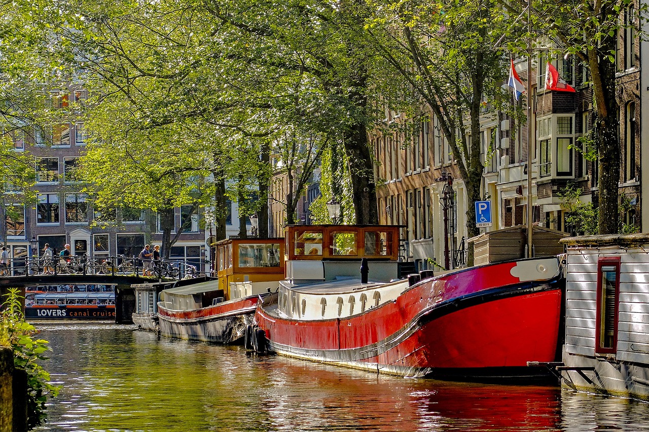 Red and blue houseboat on an Amsterdam canal