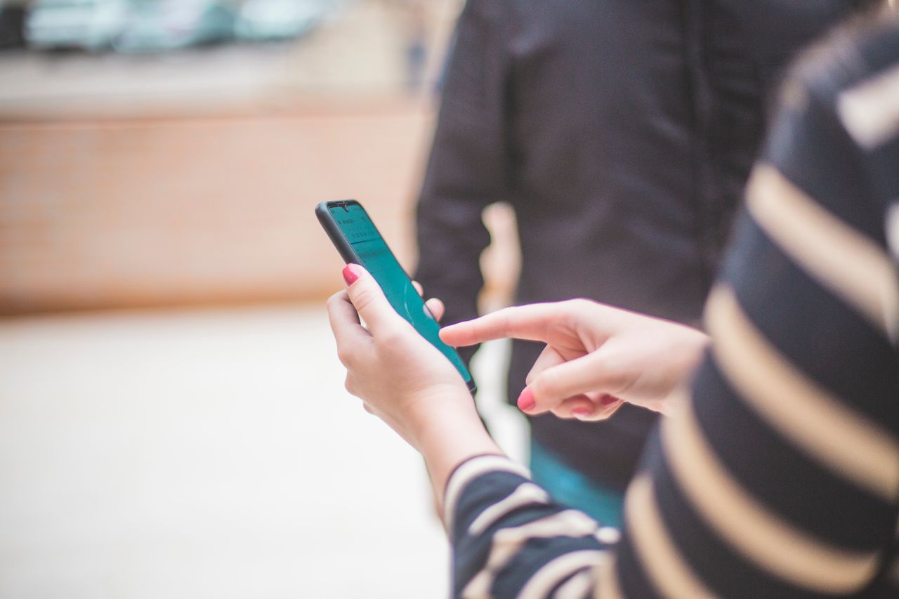 Hands holding a smartphone